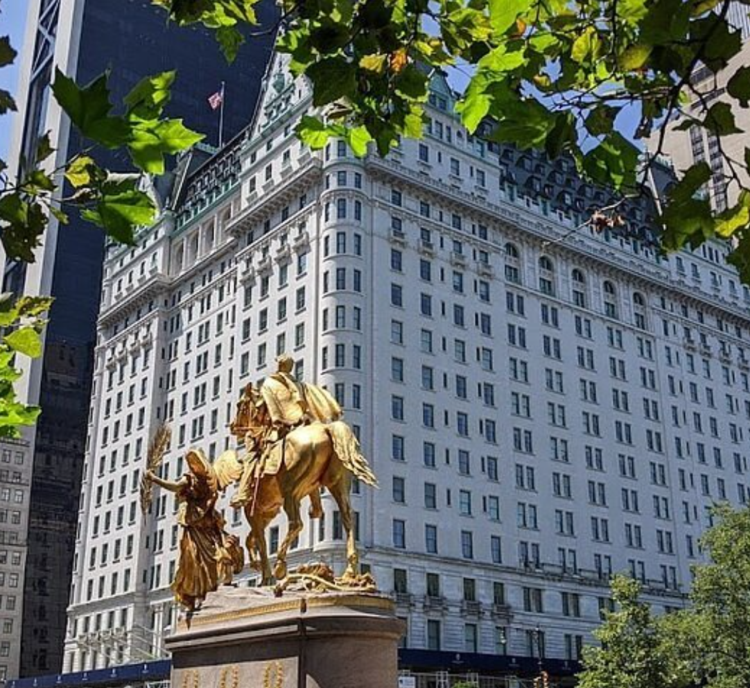The Plaza Hotel New York façade with the golden Pulitzer Fountain statue