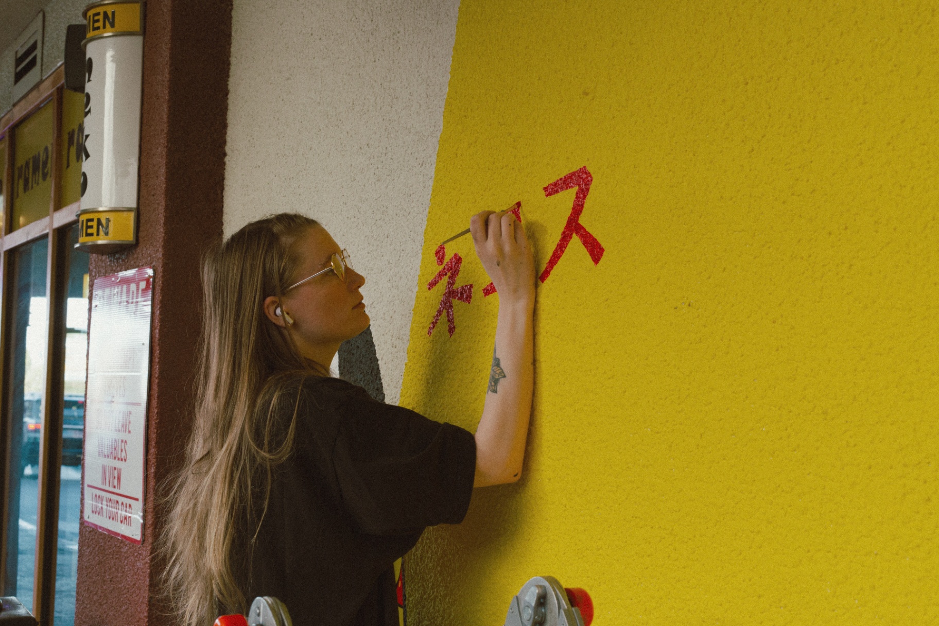 Taylor painting a mural